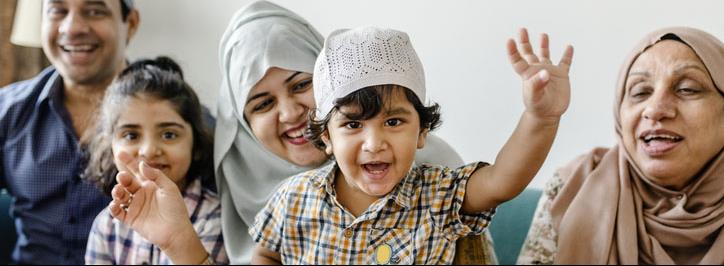 Muslim family waving